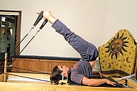 Franz Kopp of Gateway exercises on a Pilates Universal Reformer. photo by David N. Seelig