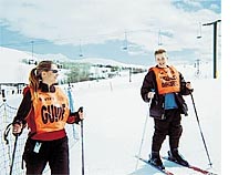Cara Larocca, ski instructor and alpine adaptive specialist, takes a break with student T.J. Squires. courtesy photo