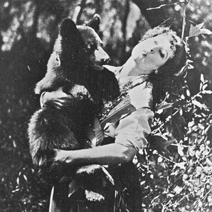 Nell Shipman cradles her pet bear, Brownie, who appeared in many of her movies while they lived at Priest Lake, Idaho, 1923. photo courtesy Nell Shipman Archives  Boise State University