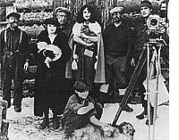 The Nell Shipman Company at Lionhead Lodge, 1923, from left to right: Daddy Duffill, Dorothy Winslow, Bert Van Tuyle, Nell Shipman, Bobby Newhard and Ralph Cochner. Barry Shipman and Laddie are in the forground. photo courtesy Nell Shipman Archives  Boise State University