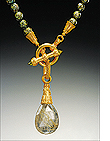 Amulet of rutilated quartz with moss pearls from the collection of jackie stewart