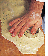 Brent Rasmussen, chef de cuisine at Baci Italian Cafe, prepares Baci tomato-chevre ravioli. Photo by David N. Seelig